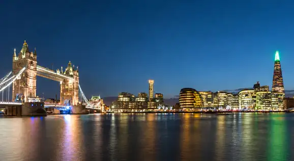 London skyline at night with Tower Bridge and The Shard